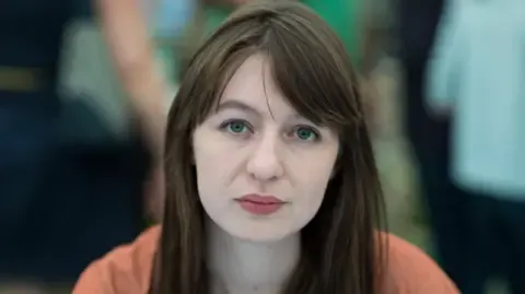 Irish author Sally Rooney states she cannot enter the UK over potential arrest